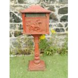 Cast iron free standing letter box.