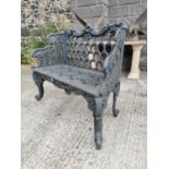 Cast iron two seater garden bench.