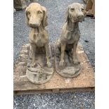 Pair of composite seated dogs.