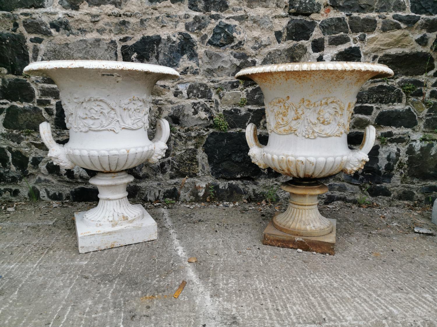 Pair of 19th C. cast iron urns.