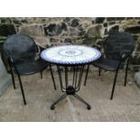 Wrought iron garden table and two chairs.