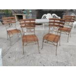 Set of four wrought iron and bamboo garden chairs.