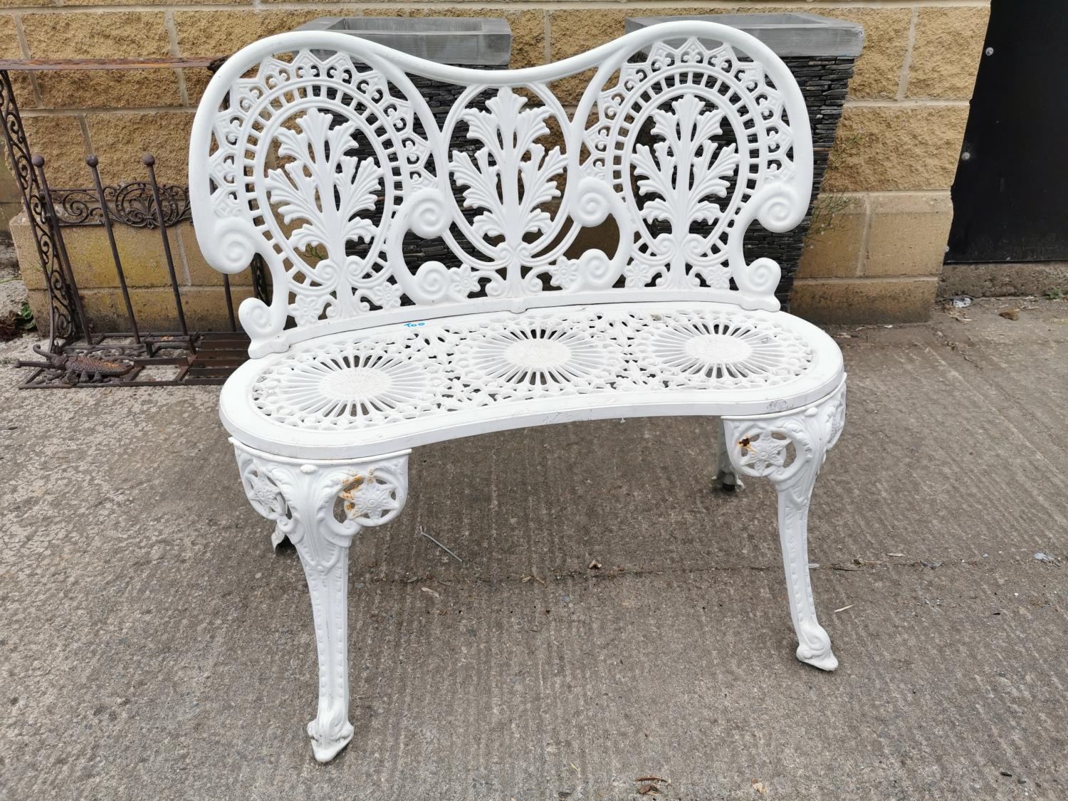 Decorative cast alloy two seater garden bench.