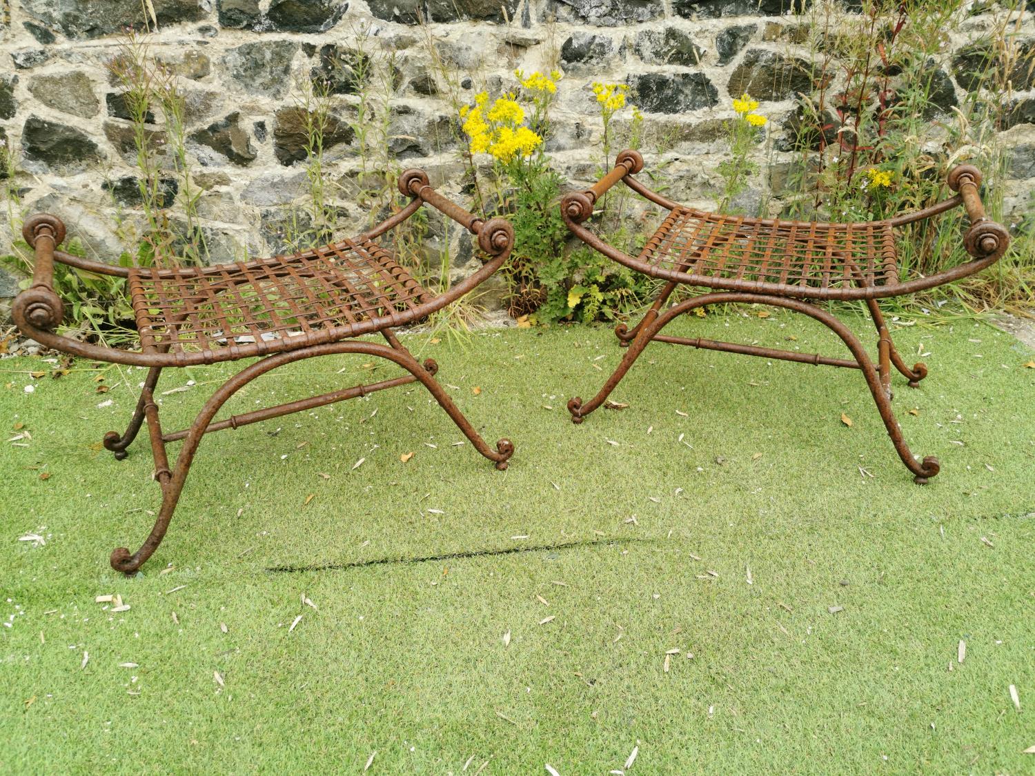 Pair of wrought iron garden stools.