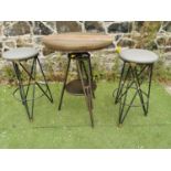 Metal high garden swivel table and two high stools.