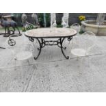 Wrought iron garden table and four chairs.