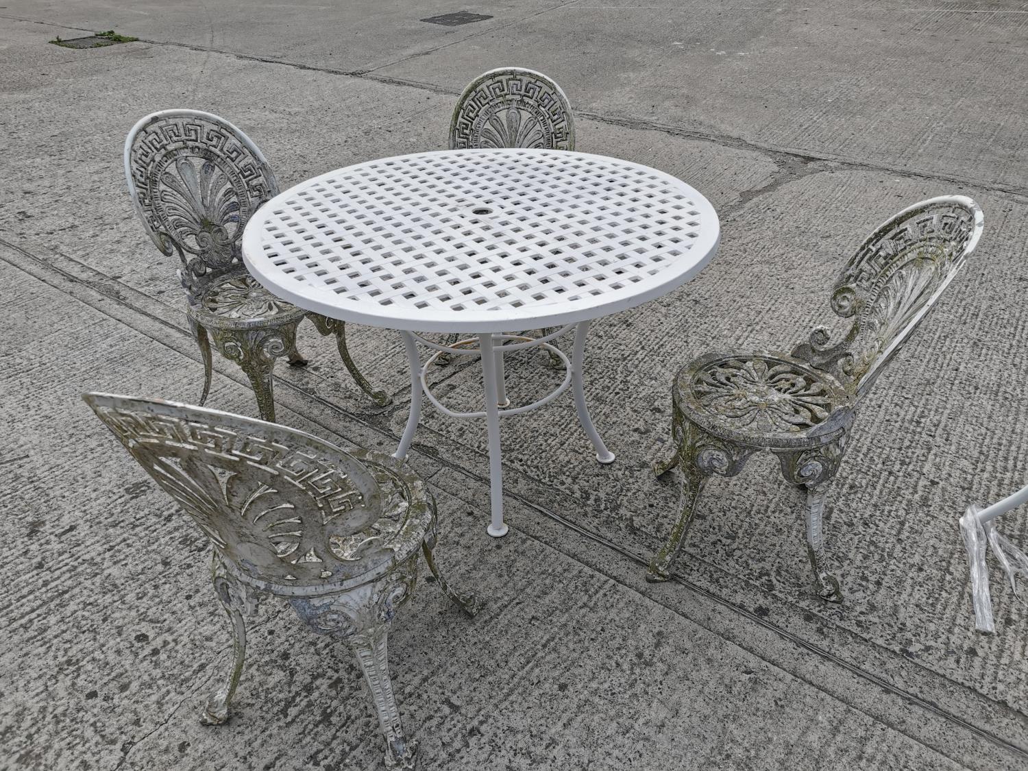 Cast iron garden table and four chairs