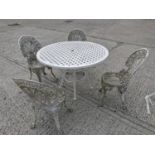 Cast iron garden table and four chairs