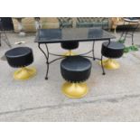 Wrought iron garden table and four stools.