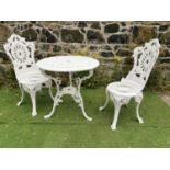 Decorative cast alloy garden table and two chairs.