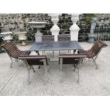 Good quality cast iron garden table and six chairs.