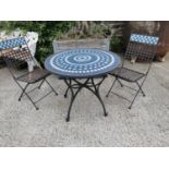 Wrought iron and mosaic three piece garden set.