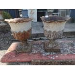 Pair of Victorian cast iron urns.