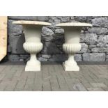 Large pair of cast iron urns