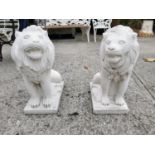 Pair of moulded stone seated Lions.