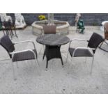 Four piece rattan and chrome garden set.