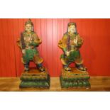 Pair of composition glazed models of Oriental warriors.