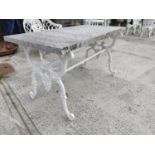 Garden table with cast iron base and marble top.