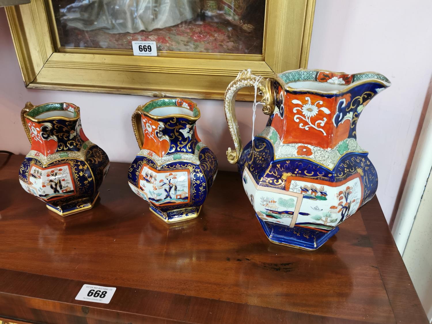 Set of three 19th C. graduated water jugs.