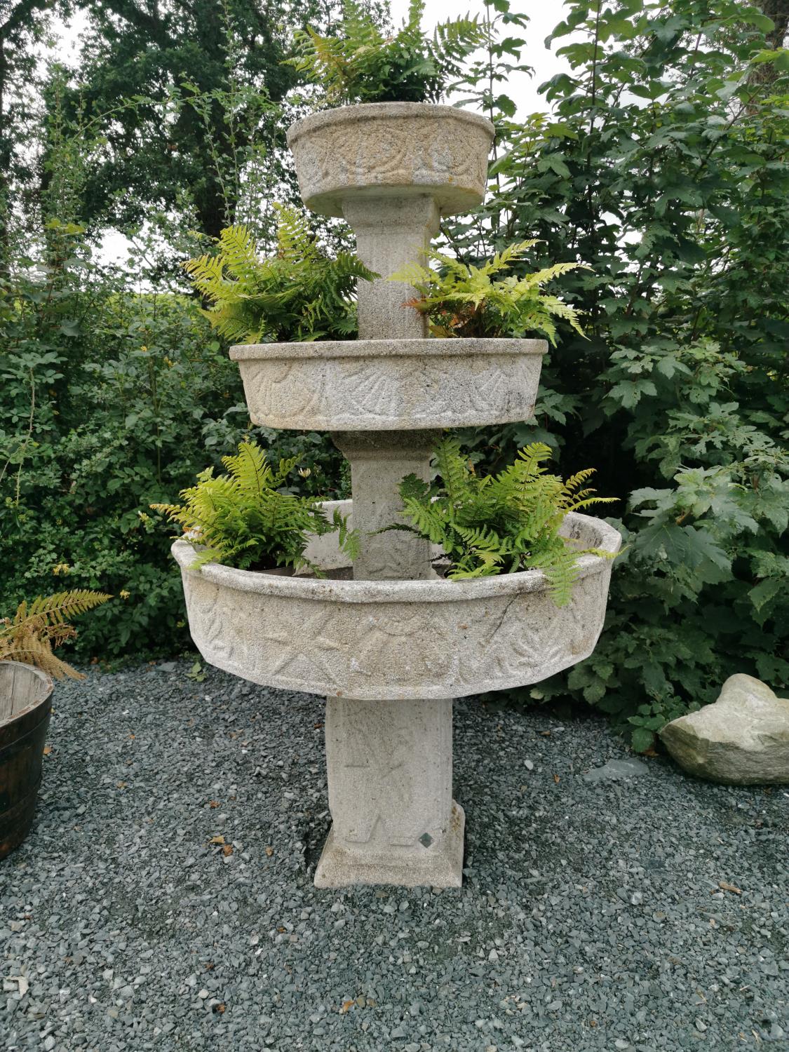 Unusual three tiered composition plant stand.