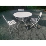 Early 20th C. wrought iron garden table and three matching chairs.