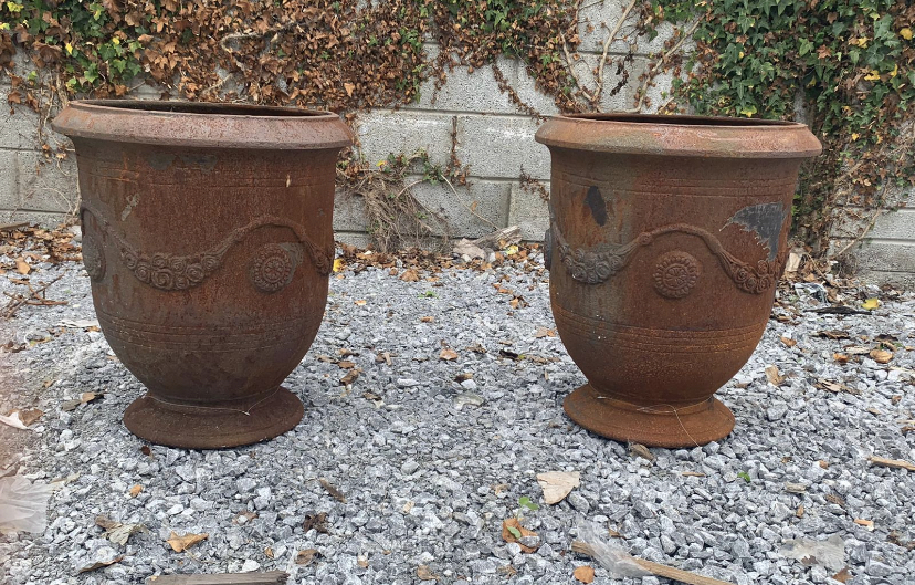 Pair of cast urns.