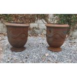 Pair of cast urns.