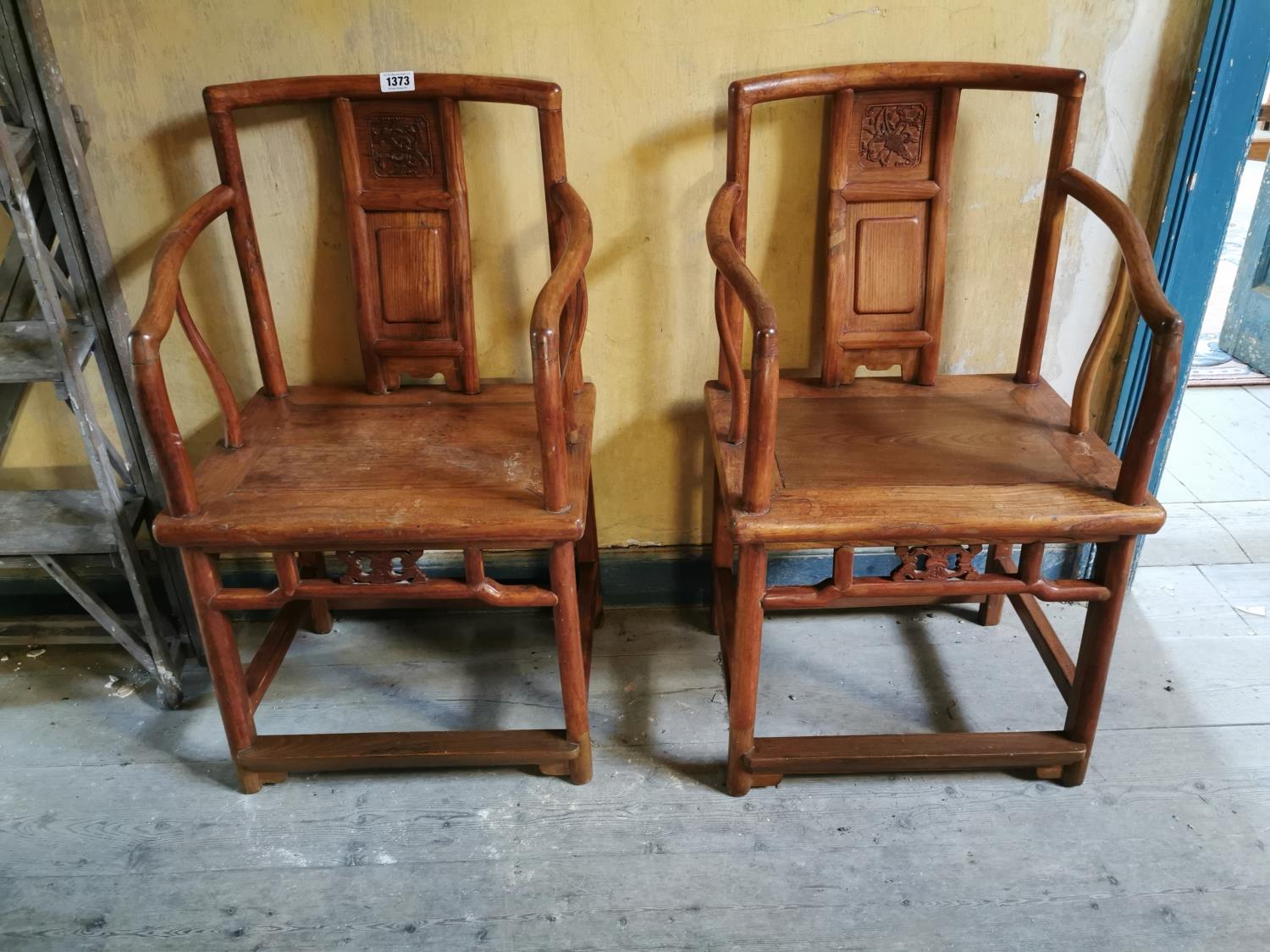 Pair of fruit wood Chinese open arm chairs.