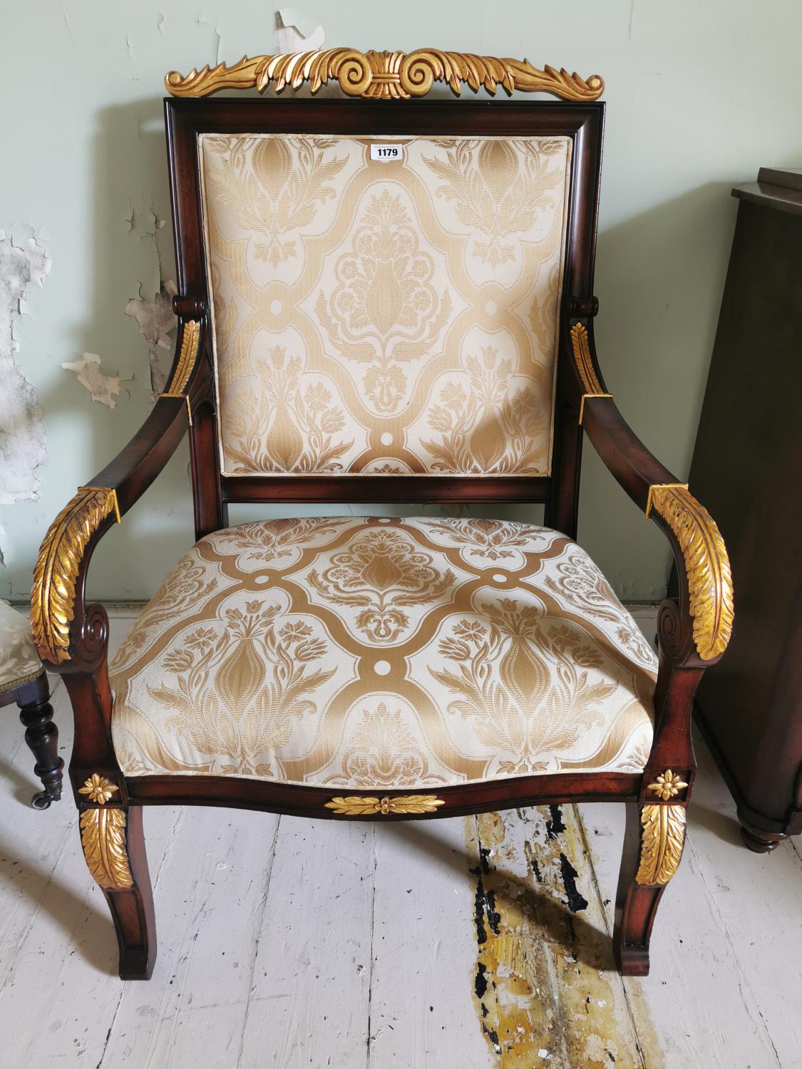 Pair of upholstered gilded mahogany open armchairs