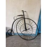 Penny Farthing with metal spoke wheels.