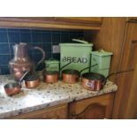 Set of five graduating copper saucepans