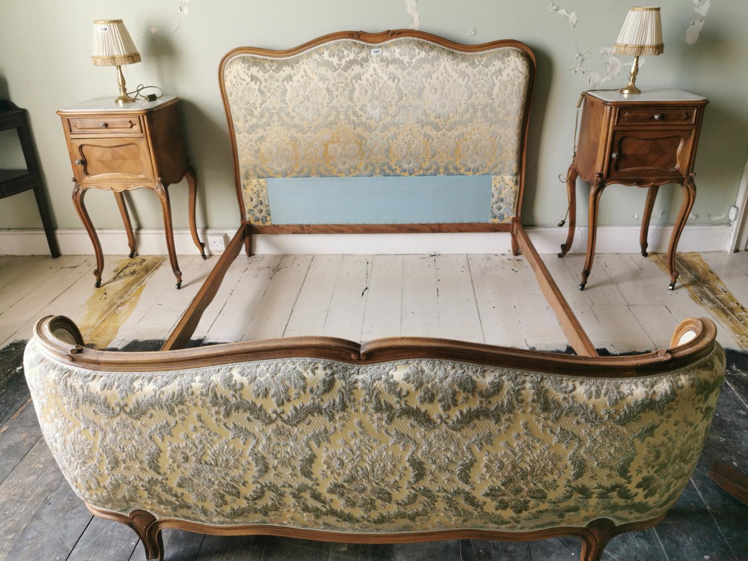 Carved walnut and upholstered French bed.