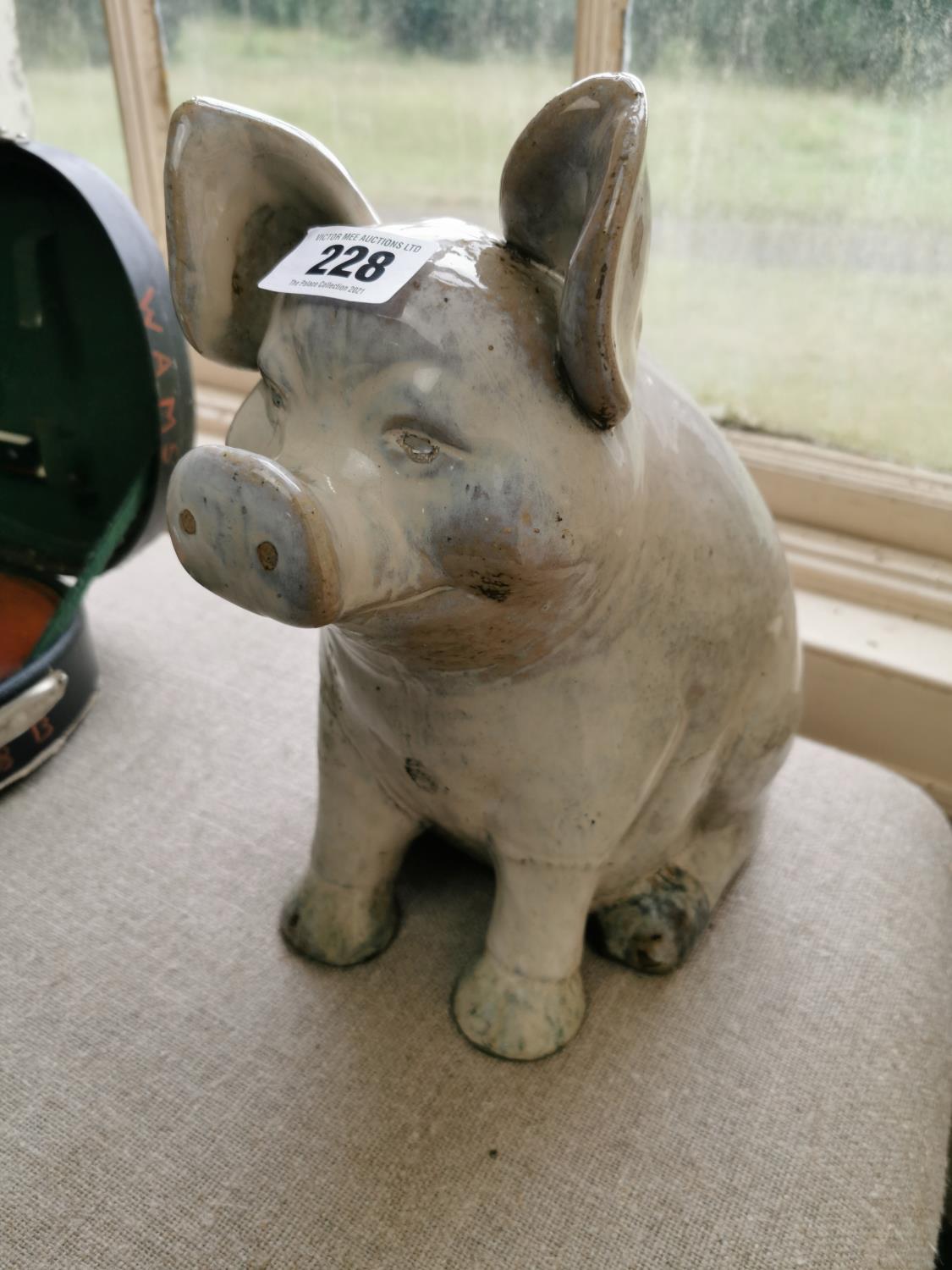 Ceramic model of a seated pig