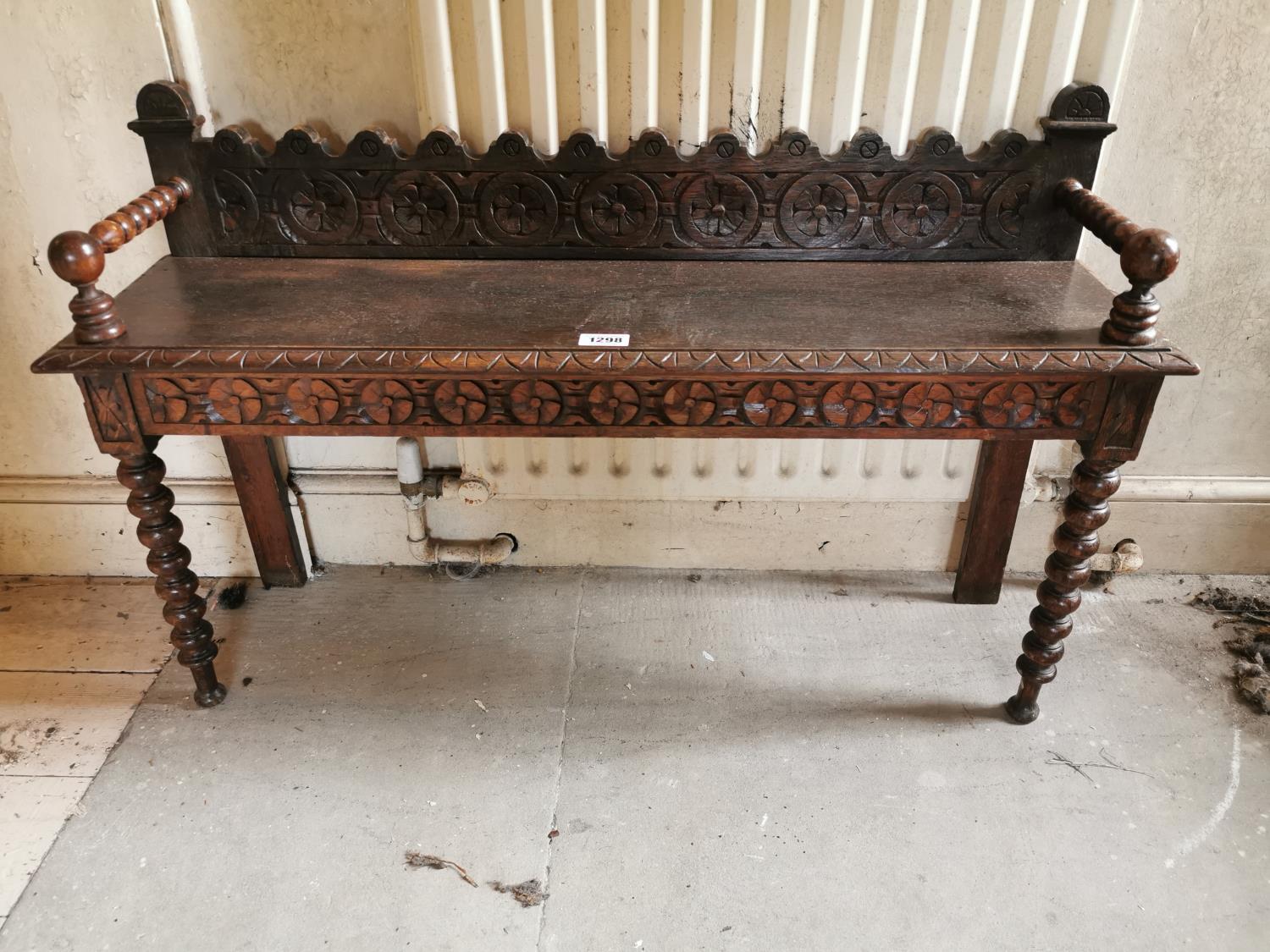 Edwardian carved oak hall bench.