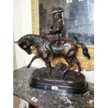 Bronze model of a horse and rider