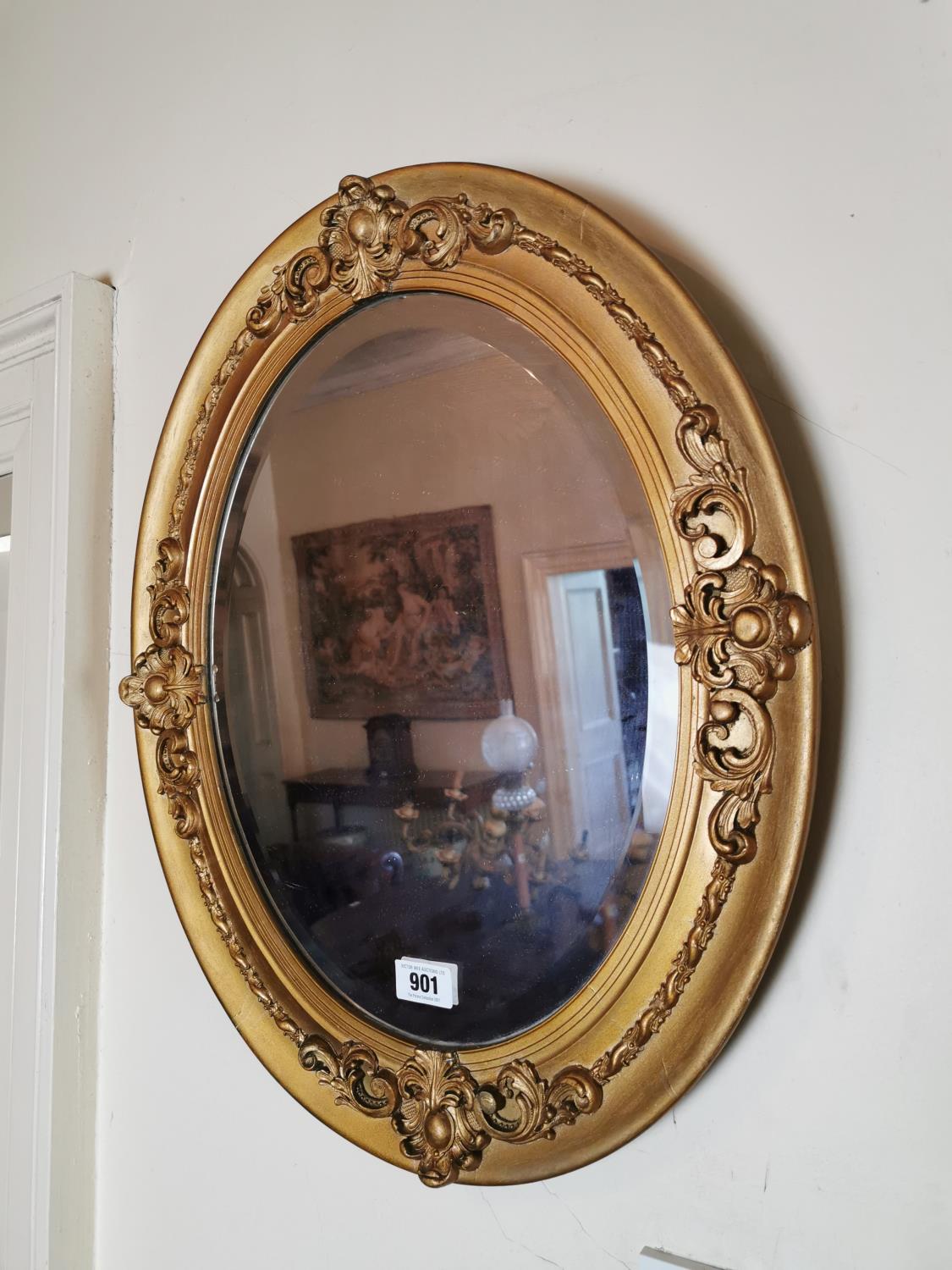 Edwardian giltwood oval wall mirror.