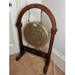 19th. C. brass dinner gong mounted on an oak stand