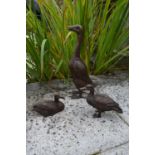 Set of three bronze ducks with two ducklings.
