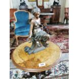 Gilded metal figurine of a seated Lady