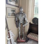 Early 20th. C. metal suit of armour on stand