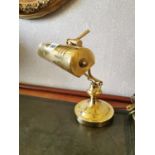 Brass desk lamp.