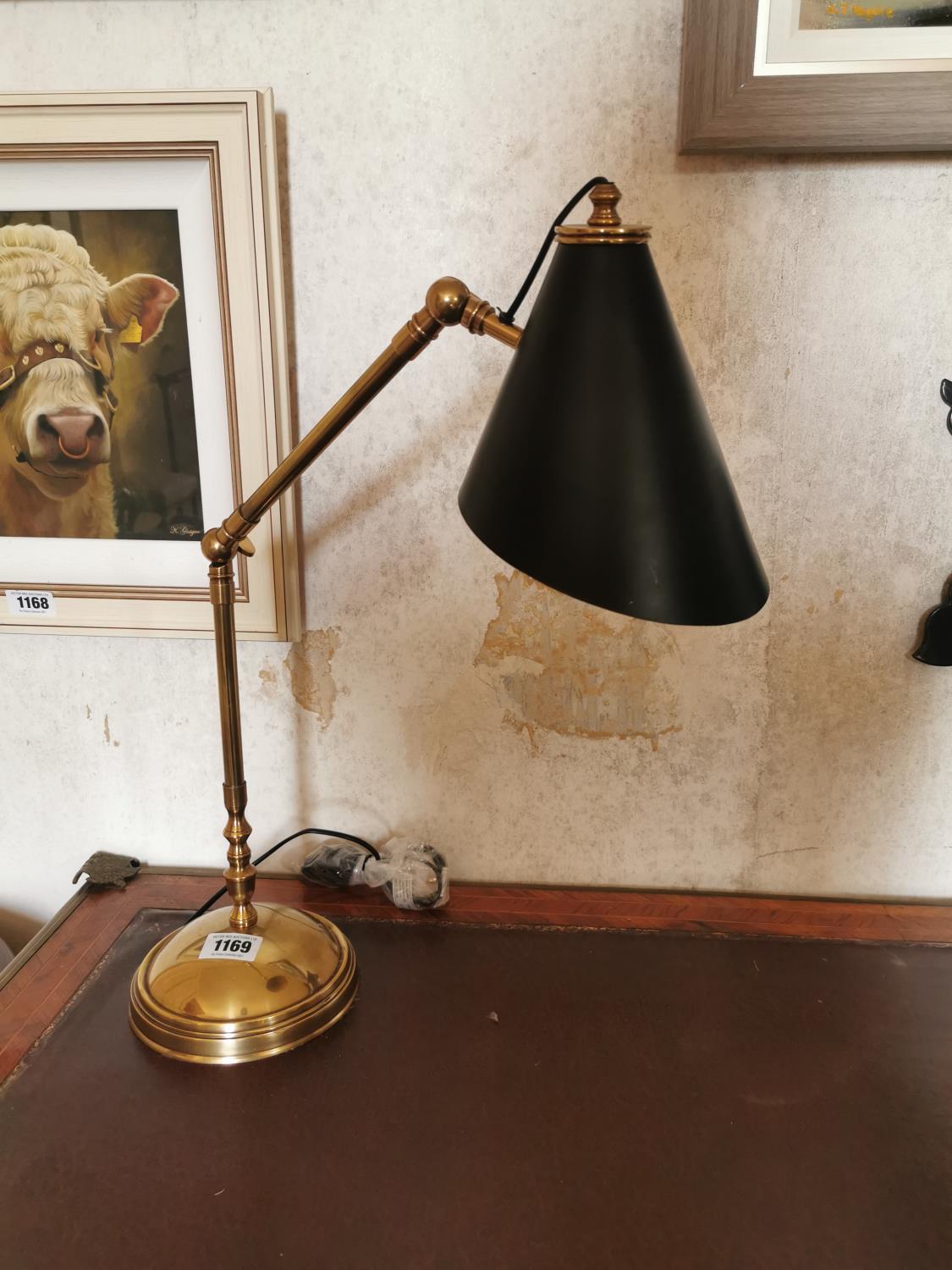 Brass adjustable desk lamp.