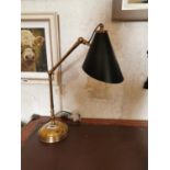 Brass adjustable desk lamp.