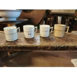 Four ceramic mugs.