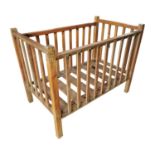 Pine cot raised on square legs