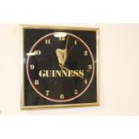 Guinness advertising wall clock.