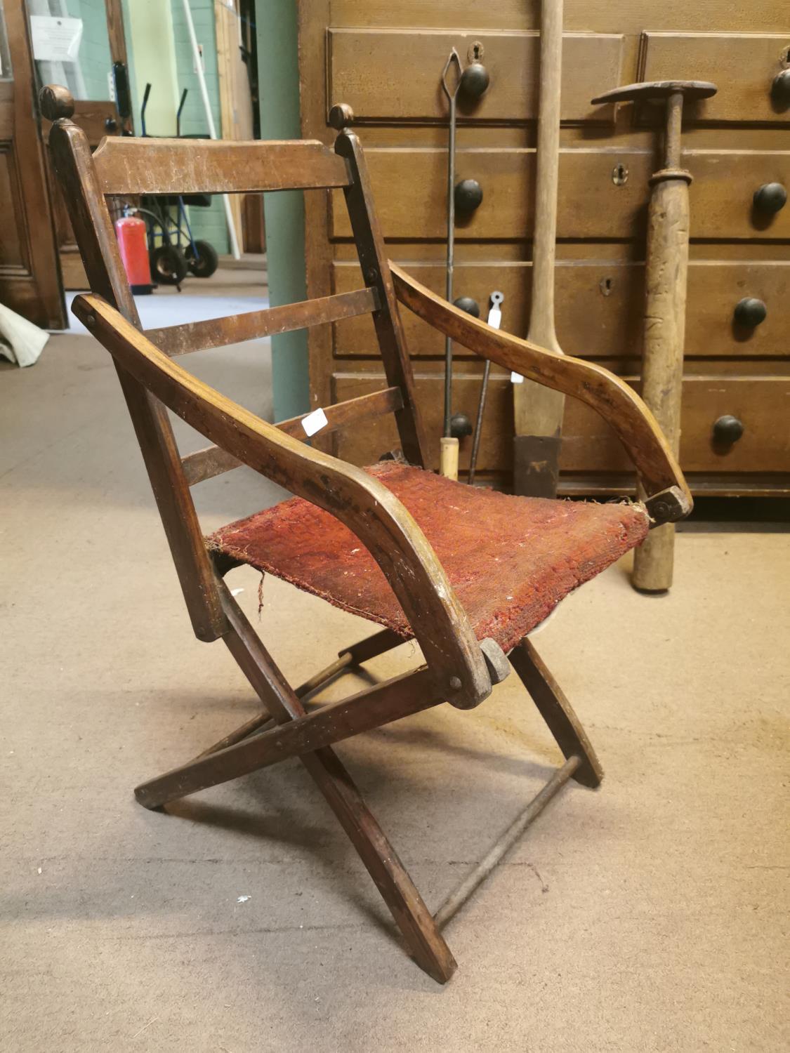 Early 20th. C. oak upholstered folding open armchair.