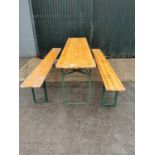 Metal and pine folding table and matching benches.