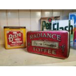 Two advertising tins