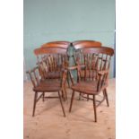 Set of six teak country kitchen arm chairs.